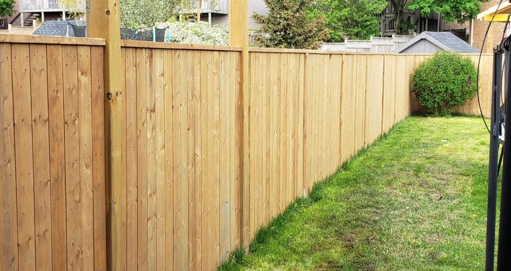 How to Keep Grass from Growing Under the Fence