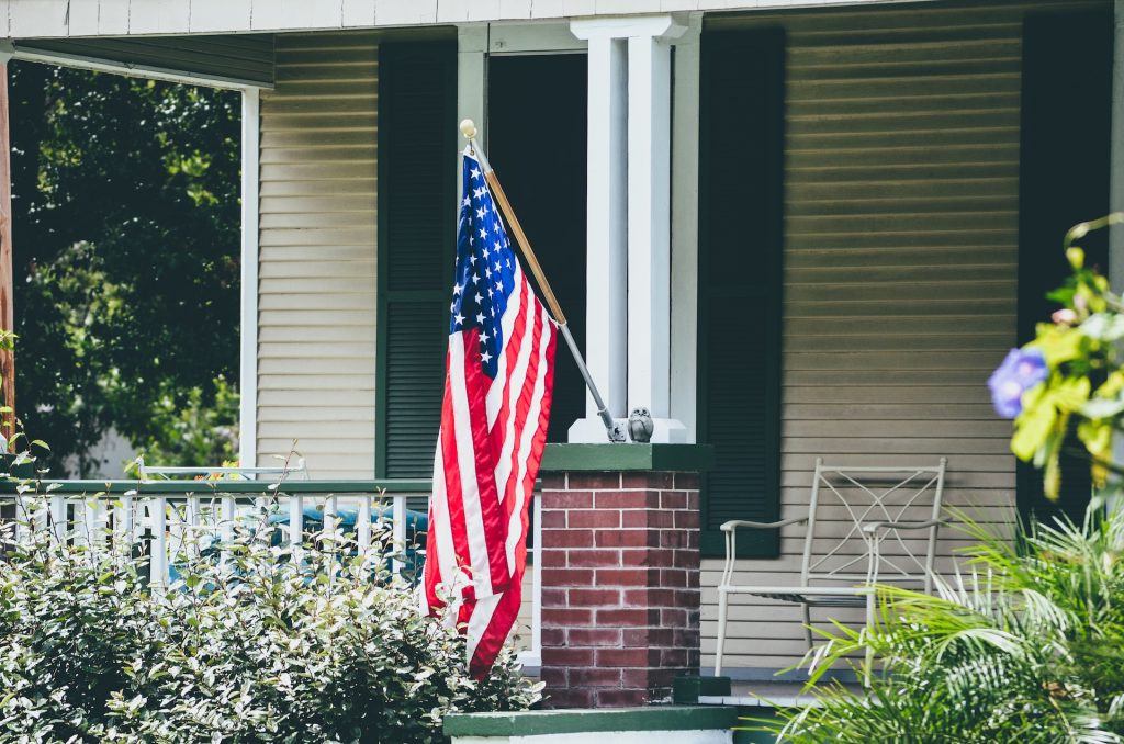 Flag mounted to the side of a house